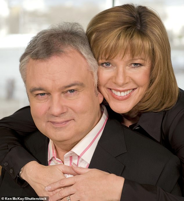 Holmes pictured with Ms Langsford after they announced their engagement in 2009.  He learned of her plan to share their divorce just hours before the statement was released through Ms Langsford's spokesman on Saturday afternoon.