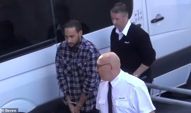 A 29-year-old man accused of indecently assaulting a child, Marhdu Andrew Rosas (pictured in handcuffs)