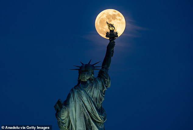 The moon will appear full at 9:35 a.m. Thursday and will reach its zenith 50 minutes after the sun sets.  Pictured is a super Flower Moon that occurred on May 25, 2023. Photo taken on May 22 in New York City - a sneak peek at the Flower Moon