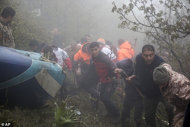 Rescue team members work at the site of the crash of a helicopter carrying Iranian President Ebrahim Raisi in Varzaghan in northwestern Iran, Monday, May 20, 2024