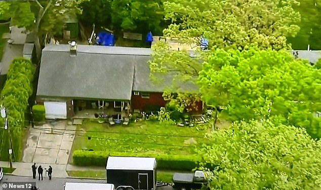 An aerial view of police inside the Massapequa Park home of alleged serial killer Rex Heuermann