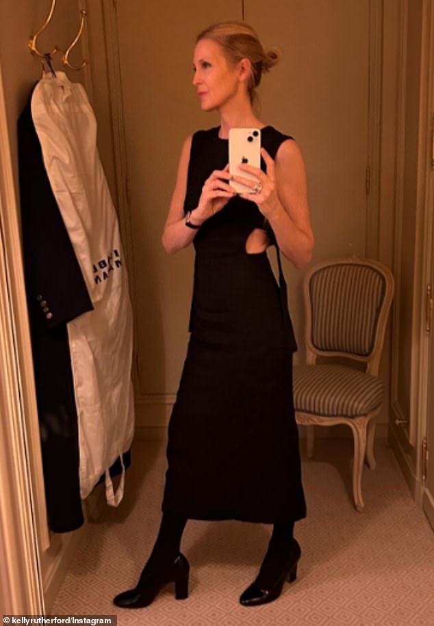 In March, Kelly took a mirror photo while trying on a little black ankle-length dress from St. Agni ($445)