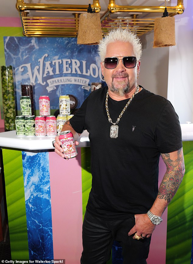 Guy Fieri, 56, says he has lost 30 pounds since 2020 thanks to a regimen of training with weighted vests, intermittent fasting and curbing his notorious appetite.  Pictured in New York earlier this month
