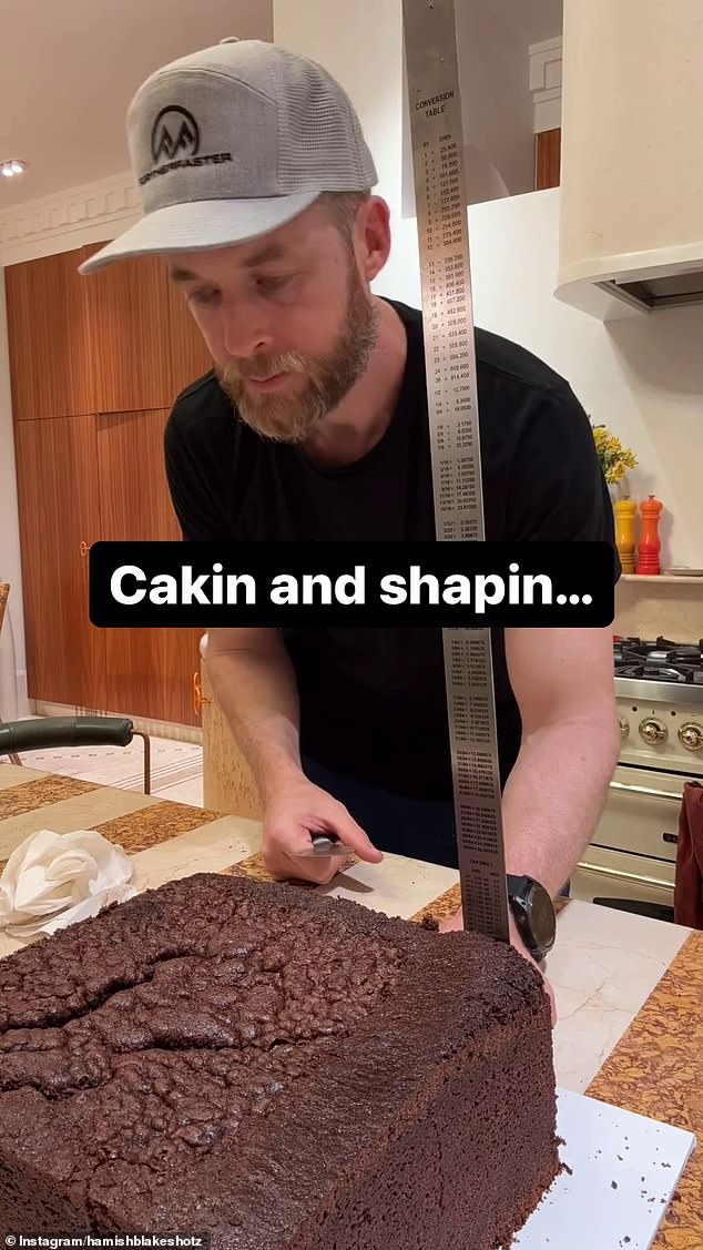 Hamish Blake (pictured) looked every bit the doting dad on Friday as he was spotted preparing a lavish custom-made Minecraft cake to celebrate his son's tenth birthday