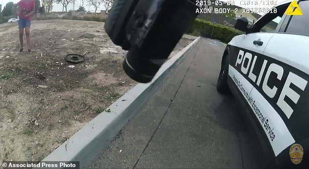 This photo was taken from May 3, 2019 police video released by the Oxnard Police Department showing an officer shooting a 17-year-old girl armed with a knife in California