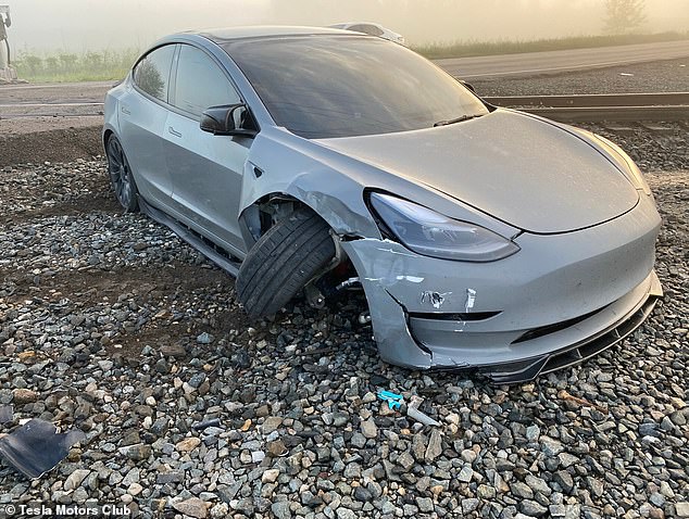 The Tesla driver claimed his vehicle was in Full Self-Driving (FSD) mode but did not slow down as he approached a train crossing the road.  In the video, the driver was reportedly forced to veer off the road to avoid a collision with the train.  Pictured: The Tesla vehicle after the near collision