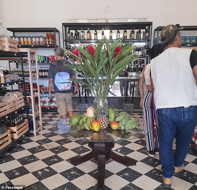 Customers shop at Home Deli, a privately owned supermarket in Havana