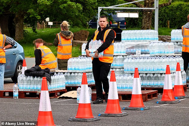 South West Water is distributing emergency rations of bottled water to everyone affected by the Cryptosporidium outbreak at Broadsands car park, Brixham yesterday