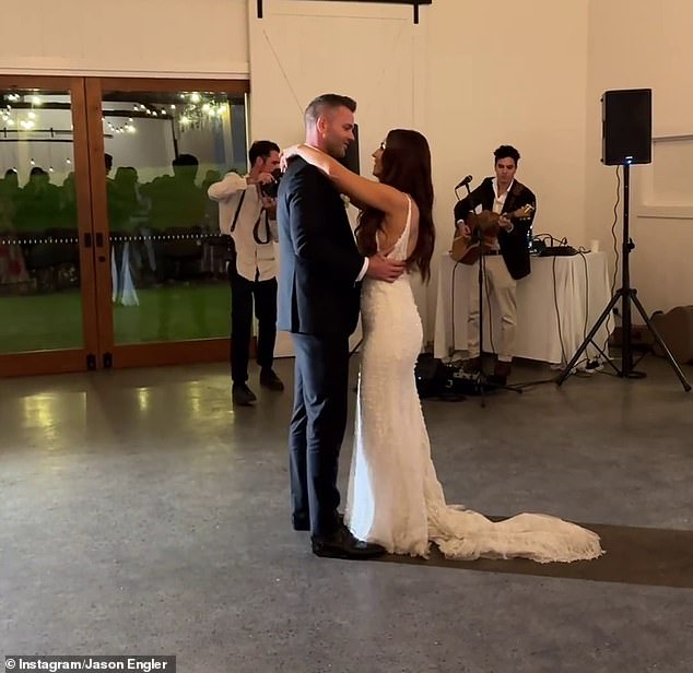 Claire looked every inch a blushing bride in a floaty white wedding gown with embroidered details and a dramatic train (pictured during their first dance)