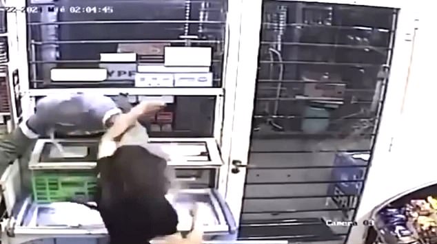 CCTV footage shows the would-be robber trying to force his way through a service hatch at a kiosk in Resistencia, Chaco province.