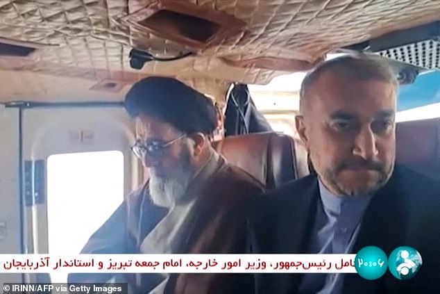 Iranian President Ebrahim Raisi (left) was photographed moments before the helicopter crash near the border with Azerbaijan, which put his 'life in danger'