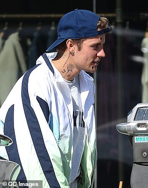 Bieber has been repeatedly caught wearing hats, like in this image from November 2022 in Los Angeles