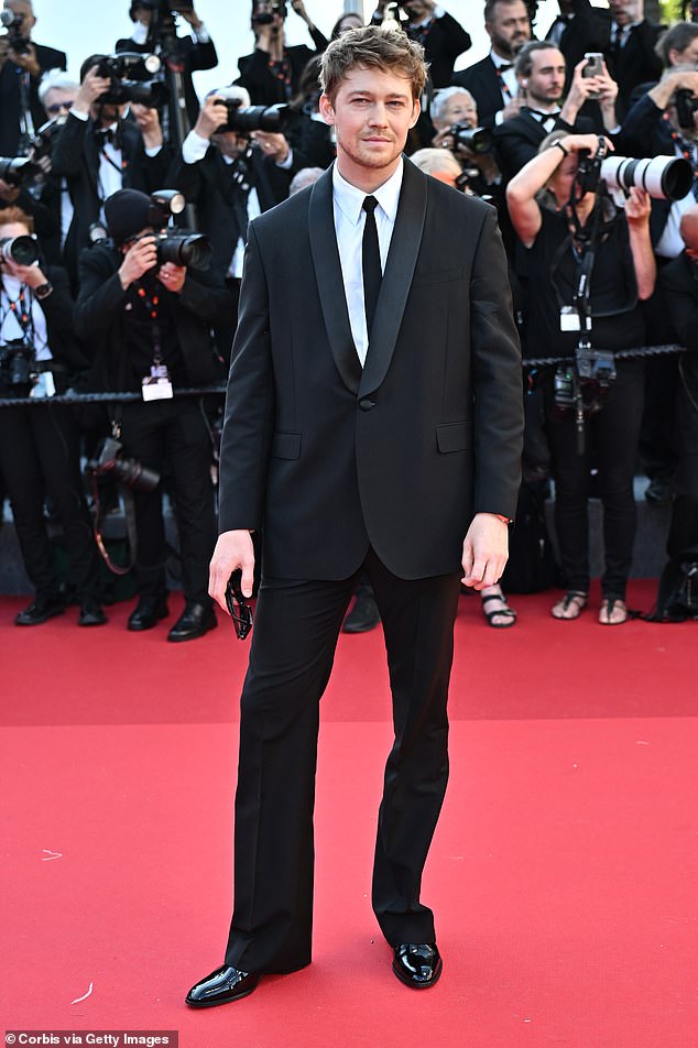 Joe Alwyn continued to put on a defiant display as he stepped out solo on the Kinds Of Kindness red carpet at the 77th annual Cannes Film Festival on Friday.