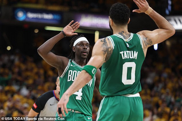 Boston Celtics guard Jrue Holiday (4) celebrates with forward Jayson Tatum after stealing