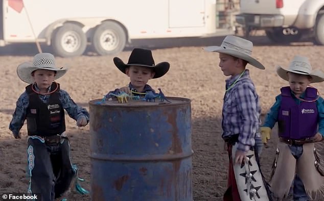 At the fundraiser for Levi, young cowboys are seen placing a plastic dinosaur on a barrel