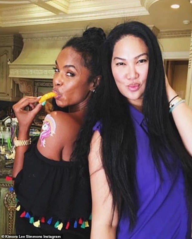 Kimora Lee-Simmons celebrated the graduation of Sean 'Diddy' Combs' twin daughters with Kim Porter (left) as she vowed to always protect them afterward