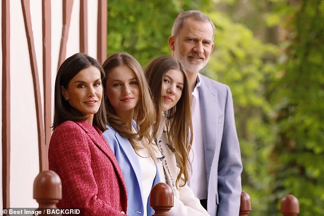 Family affair: The King and Queen of Spain chose to include their daughters in new official photos to mark their 20th year of marriage (photo from left: King Felipe VI and Queen Letizia pose with Crown Princess Leonor and Princess Sofia)