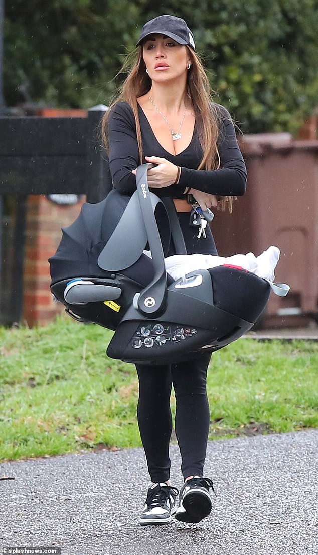 Lauryn Goodman, 33, is considering a move to Dubai, a source close to her has told MailOnline amid the fallout from her paternity scandal with footballer Kyle Walker (Lauryn pictured with her baby daughter)