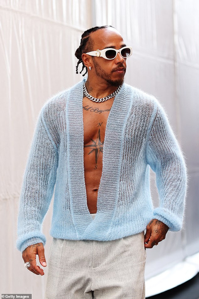 Lewis Hamilton, 39, bared his sculpted torso in a knitted blue cardigan as he walked through the paddock ahead of the F1 Grand Prix in Monaco on Thursday