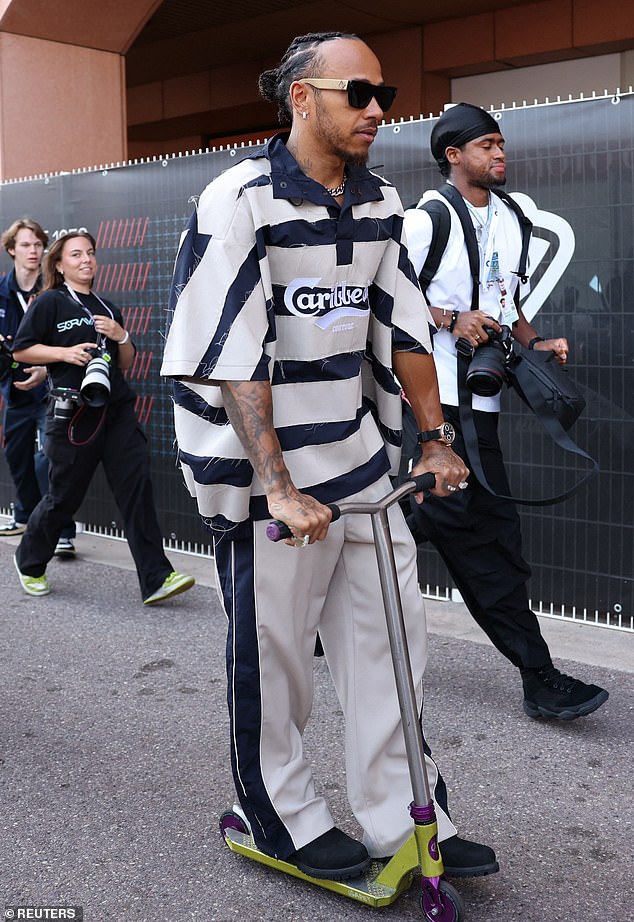 Lewis Hamilton cut a cool figure in an oversized striped jersey as he arrived in the paddock ahead of the Formula 1 Grand Prix in Monaco on Sunday