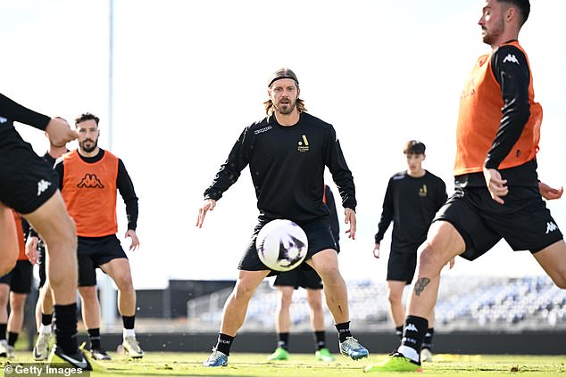 Brattan (pictured centre) is joined by the likes of Socceroos star Mat Leckie (left) and young player Nestory Irankunda in the battle against the Magpies