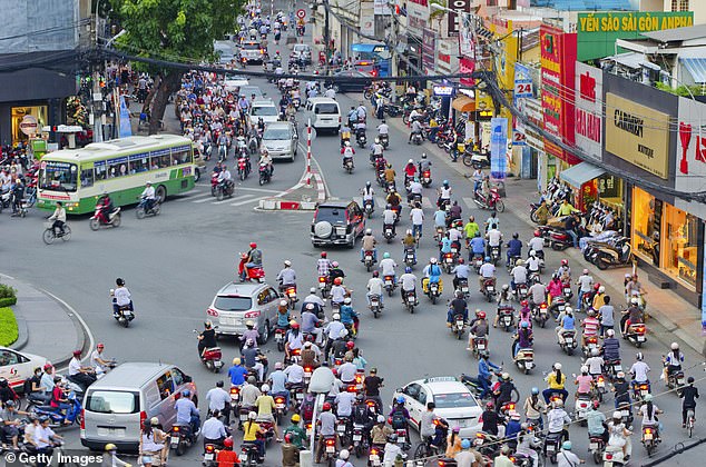 Streets in Vietnam are notoriously chaotic, like this roundabout pictured above in the country.  Experts say excessive sleepiness increases the risk of accidents