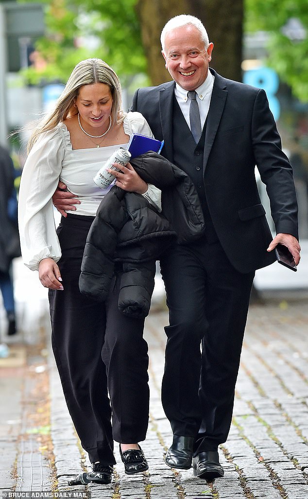 Joynes, 30, arrived at the court laughing with her father on Tuesday afternoon and left Manchester Crown Court