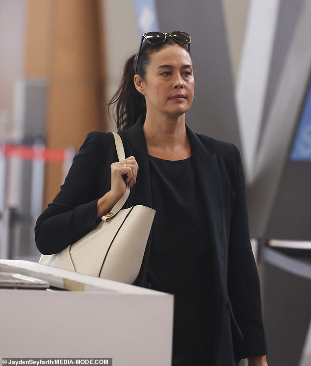 Megan Gale (pictured) turned heads on Friday when she was spotted without make-up at Sydney Airport