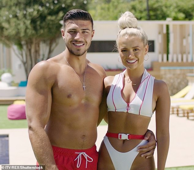 Molly-Mae is pictured on Love Island 2019 with her now fiancé Tommy Fury