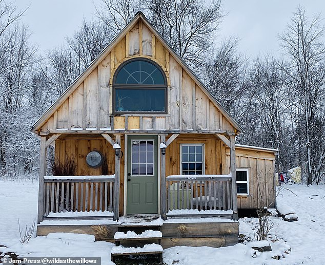 Former teacher and single mother, Ashley, 32, has always had a deep love for 'Mother Earth'.  She longed to be one with nature from an early age (cabin pictured)