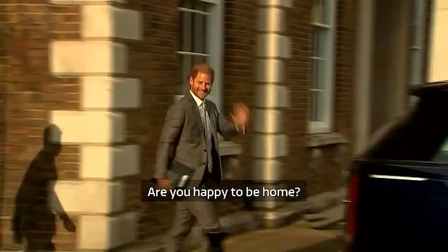 A smartly dressed, smiling Prince Harry said hello and waved to onlookers as he walked with a black folder under his arm