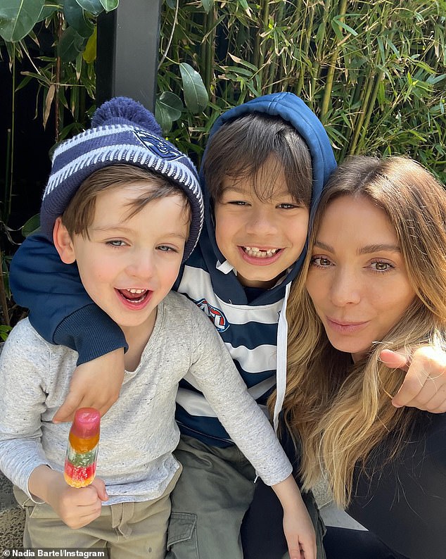 The 38-year-old shares sons Aston, eight, and Henley, six, with her AFL star ex-husband Jimmy Bartel, to whom she was married from 2014 to 2021.  Pictured with her sons