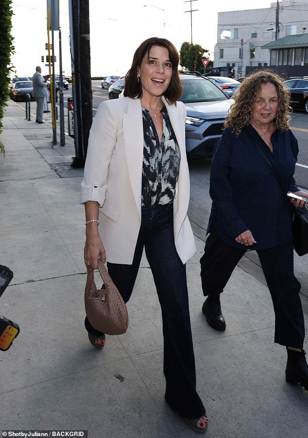 Neve Campbell looked as radiant as ever as she headed out to dinner with Giorgio Baldi in Santa Monica, California, on Wednesday