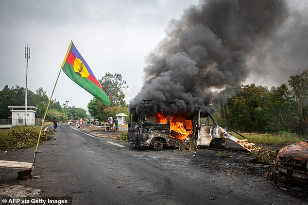 About 100 Aussies remain stuck in New Caledonia after all travel to and from the country was halted as riots gripped the Pacific country (pictured)