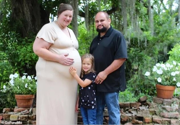 Kristin Browning, 31, and the unborn child she was due to give birth to on Friday were killed in the weather on Monday.  Kristin is seen here with her husband and daughter