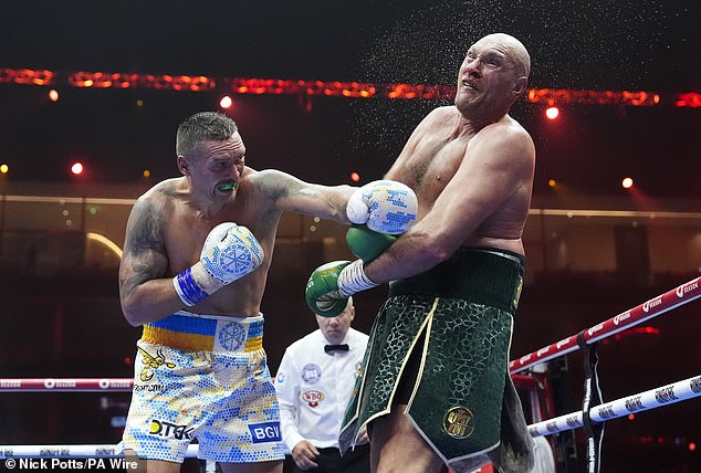 Oleksandr Usyk (left) made a stunning comeback on Saturday to defeat Tyson Fury (right)
