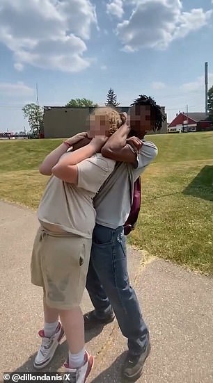 As the alleged attacker aggressively wrapped his arms around the other boy's neck, the victim tried to escape and pry the bully's arms from around his throat.