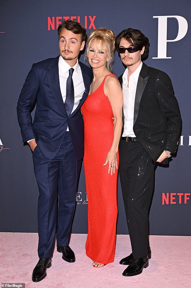 The Last Showgirl is Anderson's first film since 2022's Alone At Night;  center seen in 2023 with her sons Brandon, left, and Dylan, right