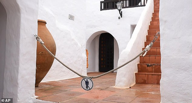 A popular Menorcan seaside resort known as 'Spanish Mykonos' has chained its streets together to prevent holidaymakers from crowding them while taking selfies