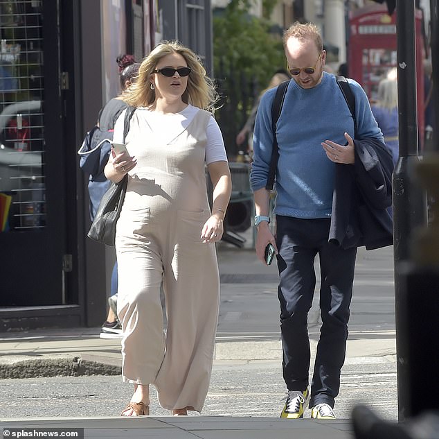 Emily Atack made the most of lingering spring temperatures on Thursday, days after a rising heat wave led to the pregnant actress needing medical attention