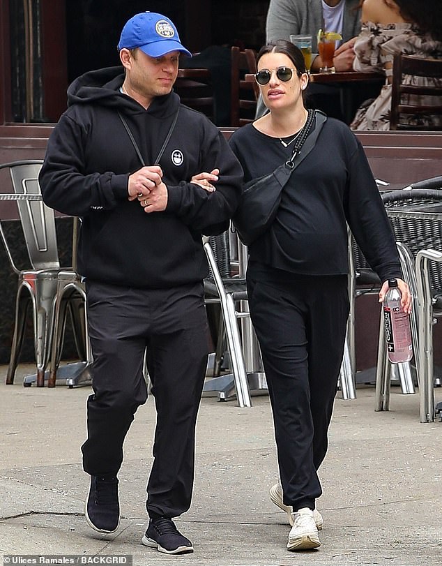 Lea Michele, 37, looked relaxed as she walked with husband Zandy Reich in New York on Saturday.  The Funny Girl star looked comfortable as she showed off her growing baby bump in a loose-fitting black long-sleeved top and matching sweatpants