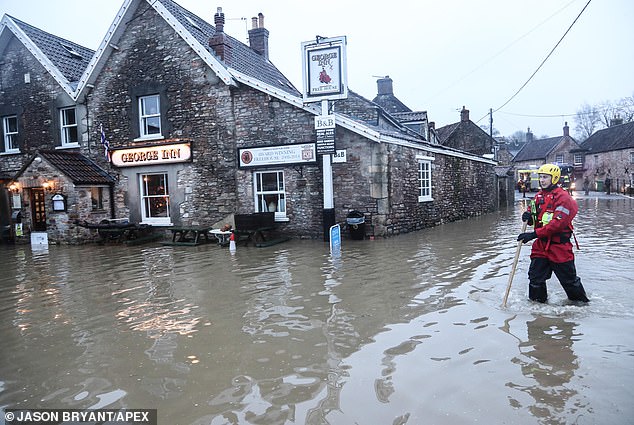 According to scientists, the list of essential items that the government needs in case of an emergency is missing some important items that could promote survival, such as flooding.  Pictured is a flooded pub earlier this year in Croscombe, Somerset