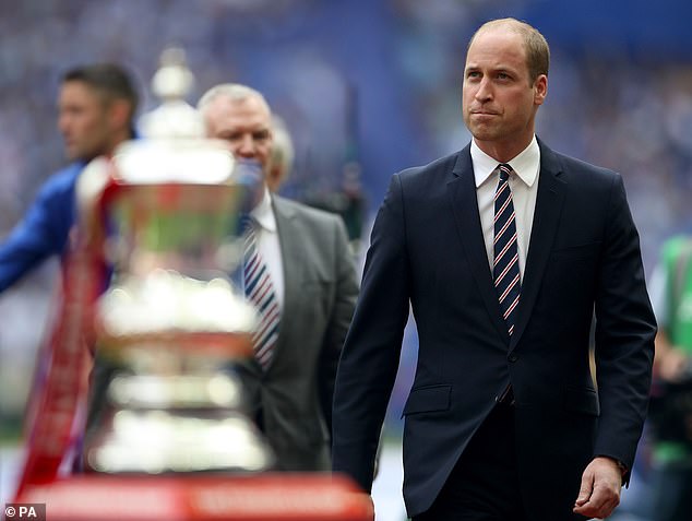Prince William walks past the FA Cup trophy during a previous final at Wembley in May 2017