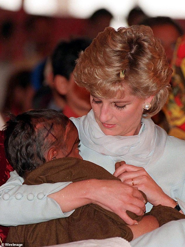 'Favorite': Of the thousands of photos Anwar Hussein took of Princess Diana, her most beloved was this one of her cradling a young cancer patient in Lahore, Pakistan, in 1996