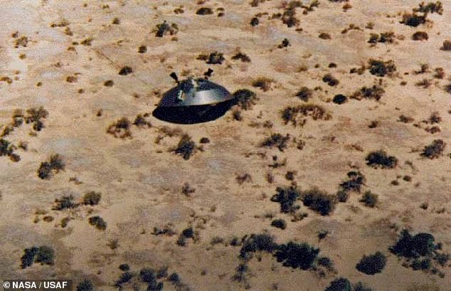 The US National Archives is demanding all UFO data by October 20, 2024. Above, the US Air Force once made public this image of a 1972 Viking spacecraft awaiting recovery at the White Sands Missile Range near Roswell, to investigate the Roswell UFO crash of 1947.  years earlier