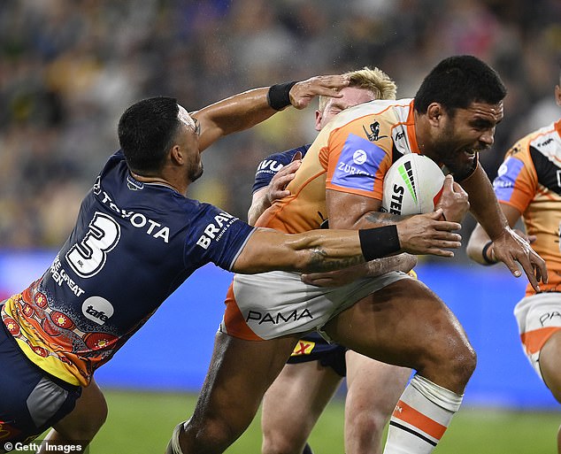 Holmes attempted this tackle on Wests forward Isaiah Papali'i late in the first half