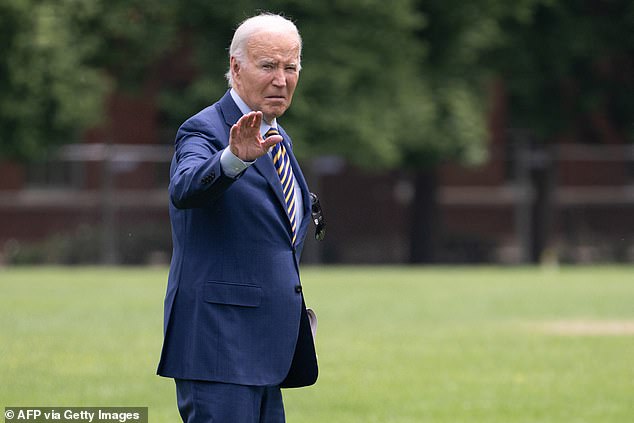 President Biden waves as he walks to Marine One on May 24, as his campaign says he is 'ready to' take the debate stage next month