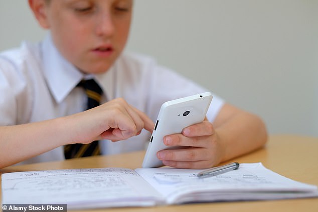 Research has shown that children who use a telephone or watch television during meals are much more likely to be overweight.  File photo