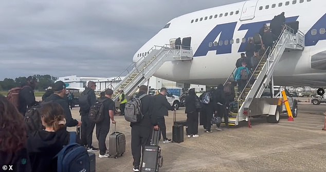 Two women are suing the Jaguars and their former kicker after claiming he sexually assaulted them on a team flight to London last year (Photo: Jaguars players board flight)