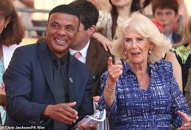 Queen Camilla and William Clements, vice president of global sponsorship and sports marketing for Mars, attend the final day of the Badminton Horse Trials in Gloucestershire